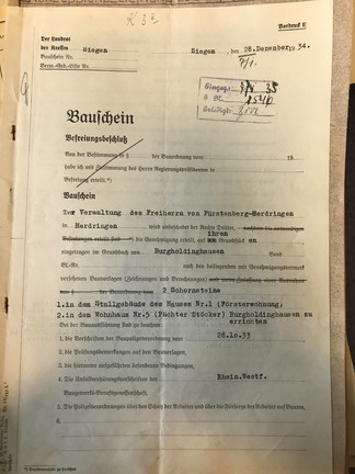 Baubescheid vom 28. Dezember 1934 über die Genehmigung des zweiten Schornsteines mit Zeichnung.